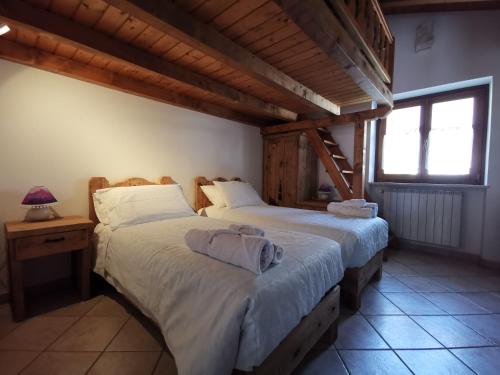 Posteľ alebo postele v izbe v ubytovaní Chalet Lullaby