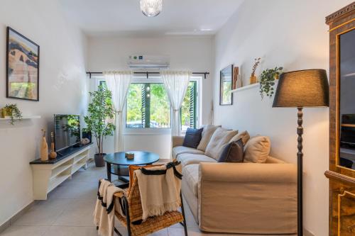 a living room with a couch and a table at Arty Haven - Spacious 3-BR House in Larnaca in Larnaca