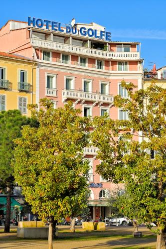 a large pink building with a sign on it at Hôtel Du Golfe in Ajaccio
