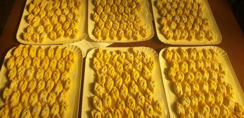 a group of yellow food sitting on a table at GRAZZANO ANTICA STAZIONE in Grazzano Visconti