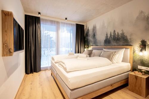 Ein Bett oder Betten in einem Zimmer der Unterkunft GRIMMINGlofts Top 2