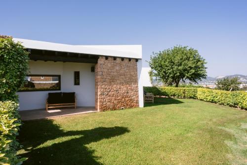 a view of a house with a yard at Casa Maca in Ibiza Town