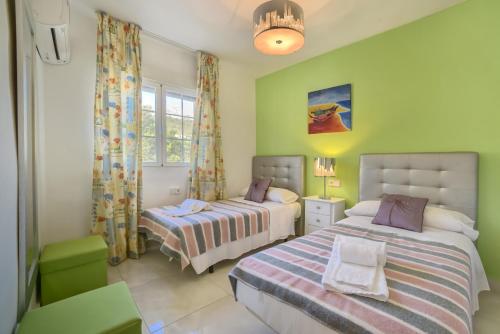 En eller flere senge i et værelse på Villa Benicuco 4 - PlusHolidays