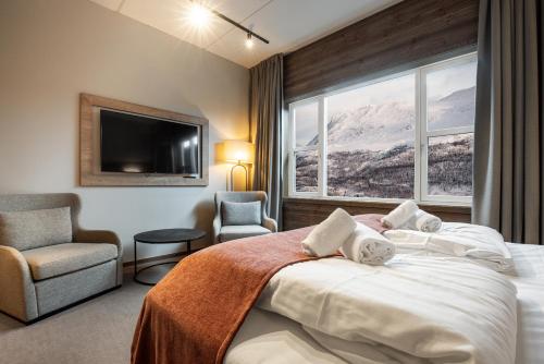 Skarsnuten Hotel and Spa by Classic Norway Hotels tesisinde bir odada yatak veya yataklar
