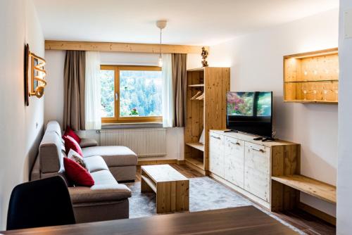 TV a/nebo společenská místnost v ubytování Apartment Rainer