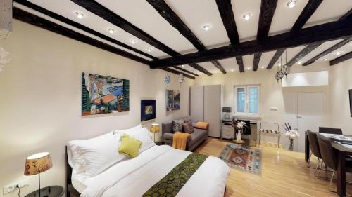a bedroom with a bed and a living room at Diocletian Studio Apartments in Split