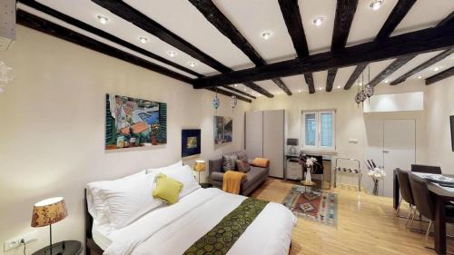 a bedroom with a bed and a living room at Diocletian Studio Apartments in Split