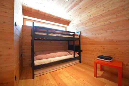 Un pat sau paturi într-o cameră la Design Lodge The Cube