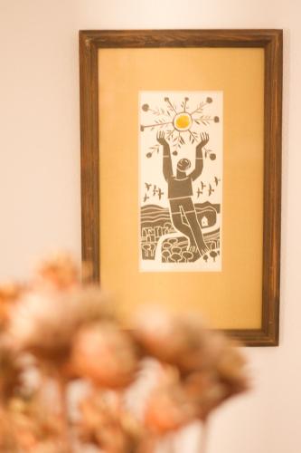 a picture of a man with the sun on his head at Penzion Marcipánka in Třeboň