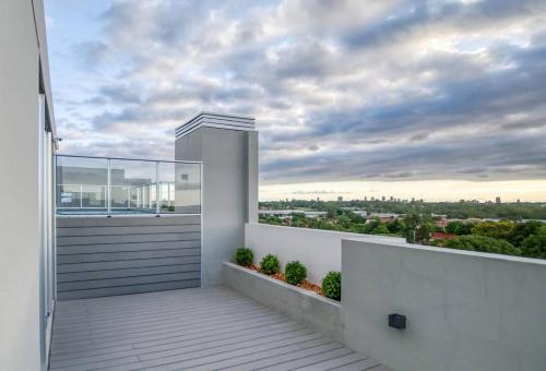 a balcony with a view of a city at A estrenar! Apartamento con pileta zona aeropuerto WIFI 200MG in La Mercedes