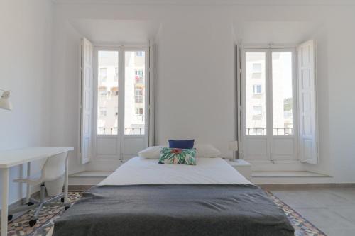 Posteľ alebo postele v izbe v ubytovaní C11 - Cosy 7 Bedrooms in Plaza Merced