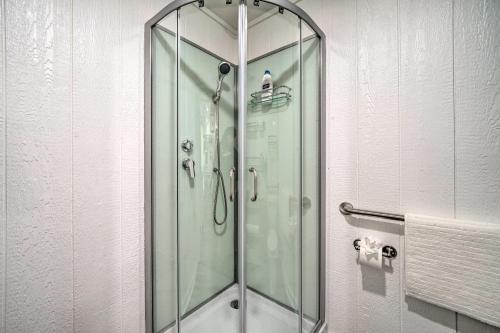 a shower with a glass door in a bathroom at Broken Bow Cabin on 15 Acres with Stocked Fish Pond! in Broken Bow