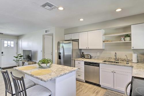 a kitchen with white cabinets and a counter top at 3 Mi to ASU! Snowbird Poolside Escape in Tempe in Tempe