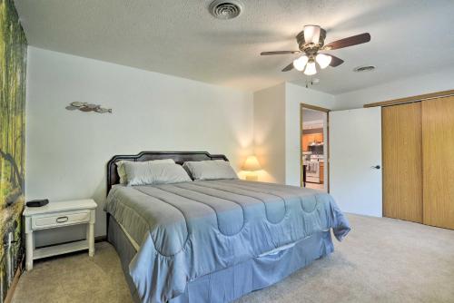 a bedroom with a bed and a ceiling fan at Table Rock Lake Retreat Less Than 1 Mi to Boat Launch in Golden