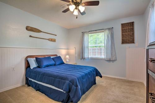 a bedroom with a bed and a ceiling fan at Table Rock Lake Retreat Less Than 1 Mi to Boat Launch in Golden