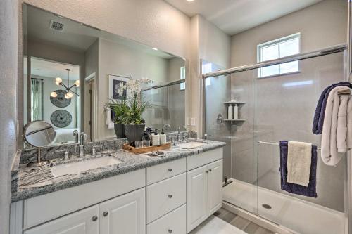 a bathroom with two sinks and a shower at Relaxing Roseville Home with Outdoor Amenities in Roseville