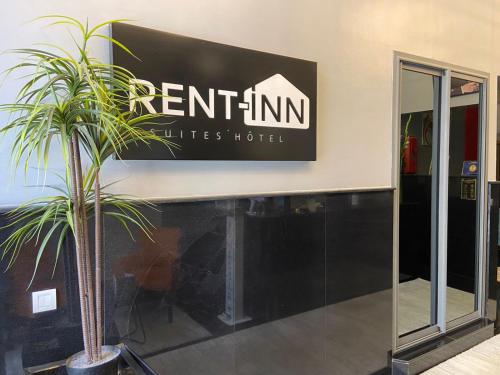 a sign for an entrance to a hotel at RENT-INN Suites Hotel in Rabat