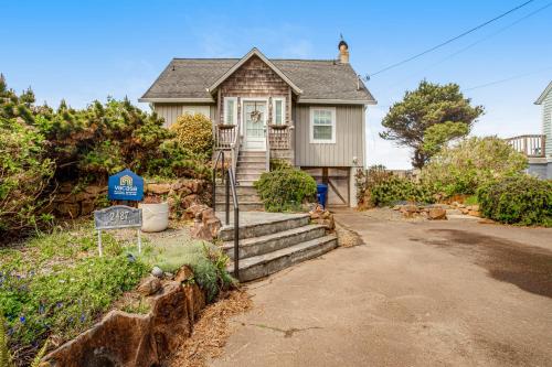 a house with a sign in front of it at Sea Cliff Cottage in Lincoln City