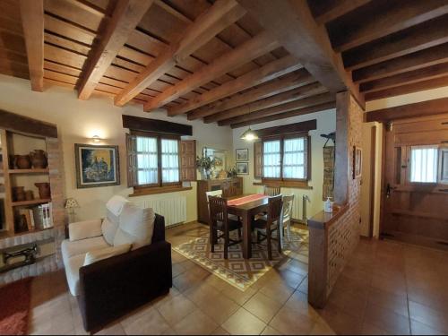 a living room with a couch and a table at Casa Cordancas in Cicera