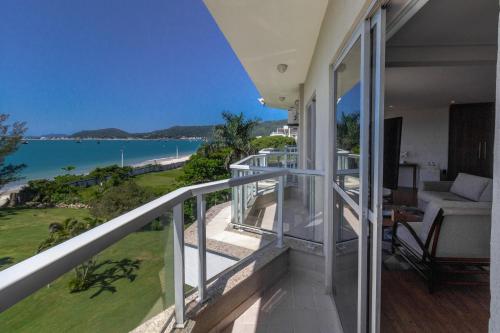a balcony with a view of the ocean at Hotel Porto Sol Beach in Florianópolis