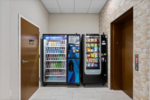 two soda vending machines in a building at Comfort Inn & Suites St Louis-Hazelwood in Hazelwood