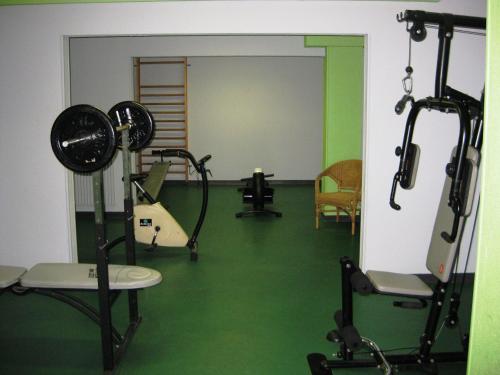 a room with a gym with a treadmill at Hôtel Residence Les Aiguades in Port-de-Bouc