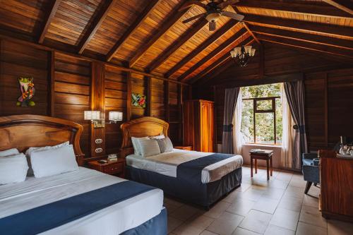 A bed or beds in a room at Hotel Campo Verde