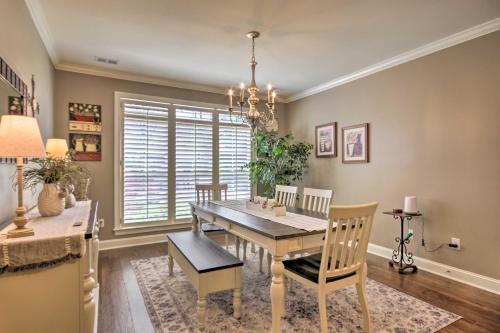 a dining room with a wooden table and chairs at Elegant Lakefront Gem with Dock and Sunset Views! in Cross Hill