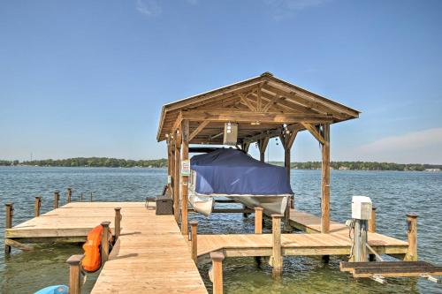 a wooden pier with a gazebo on the water at Elegant Lakefront Gem with Dock and Sunset Views! in Cross Hill