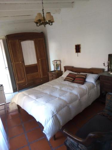 Giường trong phòng chung tại La casa de Merce
