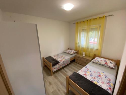 Posteľ alebo postele v izbe v ubytovaní Kraljević Apartments