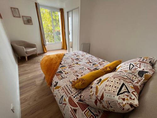 a bedroom with a bed with a banana on it at • Bel appartement - centre historique de Poitiers in Poitiers
