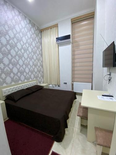 Телевизор и/или развлекательный центр в Khazri Qonaq evi / Guest House