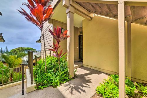 a porch of a house with flowers and plants at Kapalua Extraordinaire with Glorious Ocean Views! in Kahana