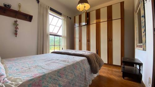 Una cama o camas en una habitación de Aventura & Tranquilidade em Secretário pertinho de Itaipava - Trilhas Mountain Bike - Passeios de Quadricilo e Cavalo - Cachoeira