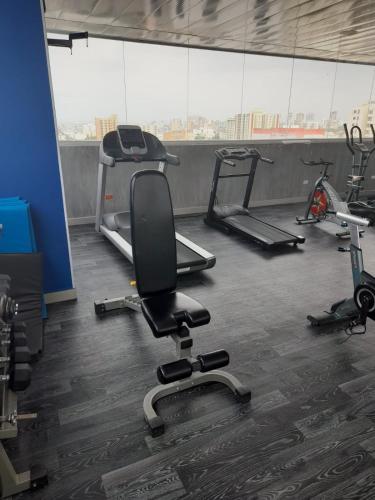 a gym with several exercise equipment in a room at Radisson Diamond Barranquilla in Barranquilla