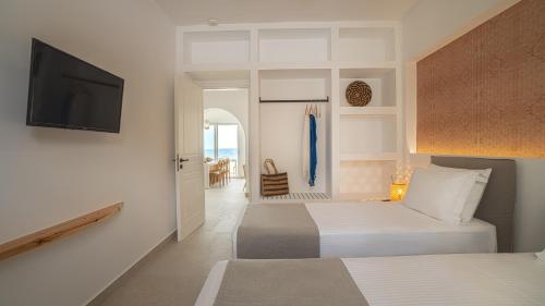 Posteľ alebo postele v izbe v ubytovaní Sfakia Seaside luxury Suites