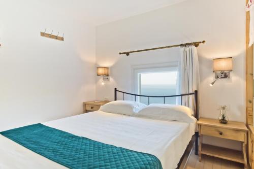 a bedroom with a bed and a window at Mountain & Sea Villa in Kyra Panagia