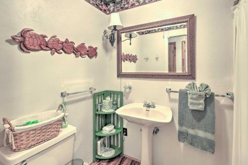 a bathroom with a sink and a mirror at Charming Abode with Dock on the Suwannee River in Bell