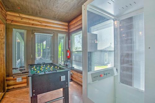 a kitchen with a stove and windows in a room at Waterfront Yantis Retreat with Deck and Zipline! in Yantis