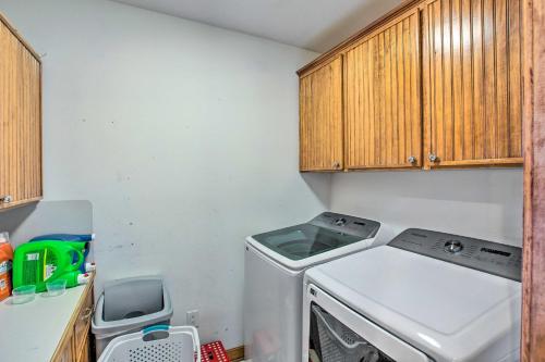 a small kitchen with a washing machine in it at Waterfront Yantis Retreat with Deck and Zipline! in Yantis