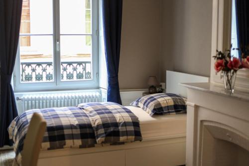 Un ou plusieurs lits dans un hébergement de l'établissement La Suite Lanterne