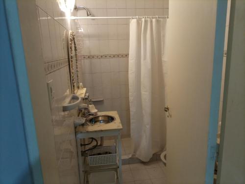 a bathroom with a sink and a shower at Departamento Zavalla 1046 in Santa Fe