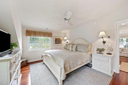 a white bedroom with a bed and a tv at Bethany West -- 719 Fenwood in Bethany Beach