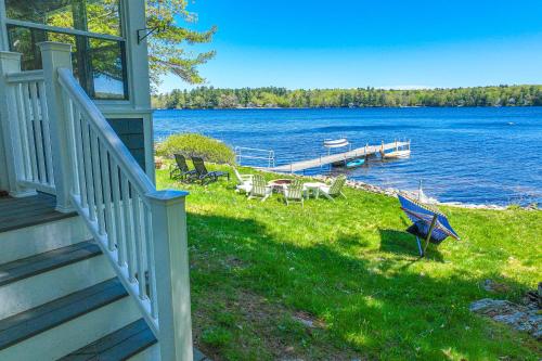 a porch of a house with a view of a lake at Highland Playhouse in Windham
