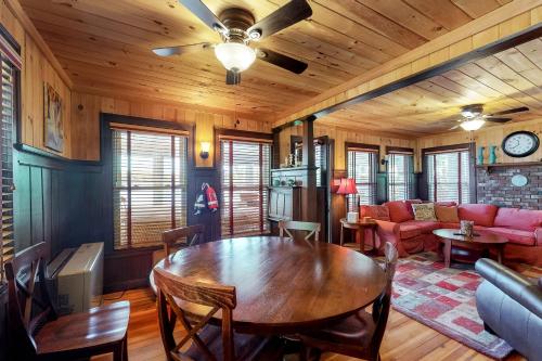 a living room with a table and a couch at Highland Playhouse in Windham