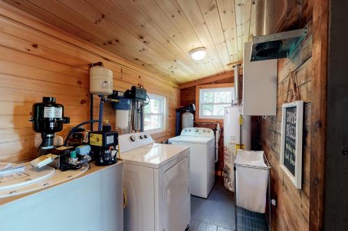 a kitchen with two washer and dryer in a house at Highland Playhouse in Windham