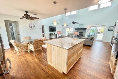 a kitchen and living room with a large island at Shore Bird in Port Saint Joe