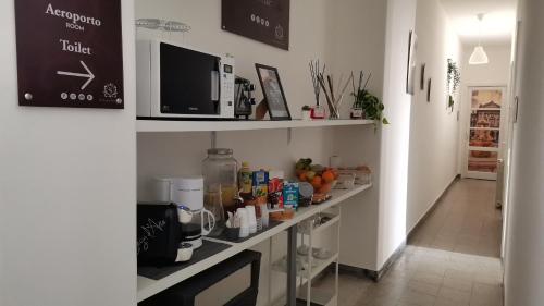 a kitchen with a counter with food on it at Casa Sofia in Catania