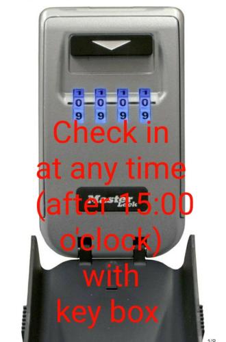 a check in machine with the words check in at any with lock at luxury - comfy center rodos in Asgourou